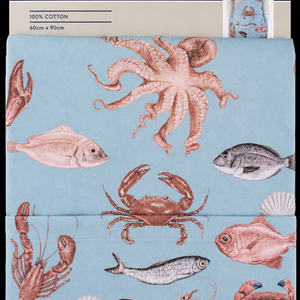 close up of blue fishermans design apron with header card